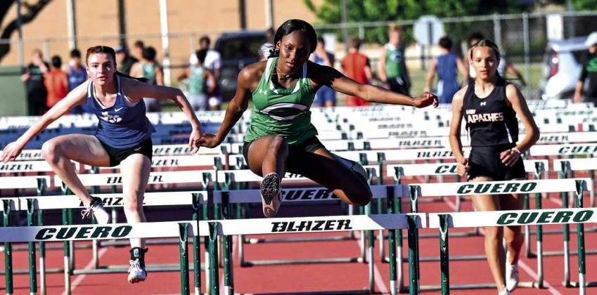Mauricinea Walker leads the pack to win the 100M hurdles.