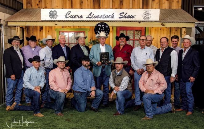 This year’s winner of the Honorary Stock Show Supporter Award, Greg Gossett, center, is surrounded by the Cuero Livestock Show Board of Directors. Gossett was honored for his decades of service to the agriculture community as a businessman and volunteer. Twenty years ago, Gossett’s father, Dr. Jay Gossett, received the same award. (Photo courtesy of John Hudgeons Photography)